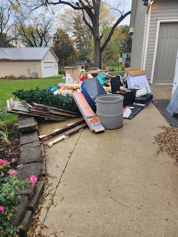Dumpster being loaded with debris for Commercial Dumpster Rental in Baytown